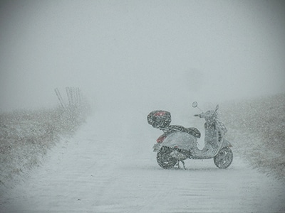 Vespa GTS scooter covered in snow