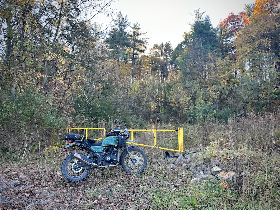 A 2022 Royal Enfield Himalayan parked at a gate.